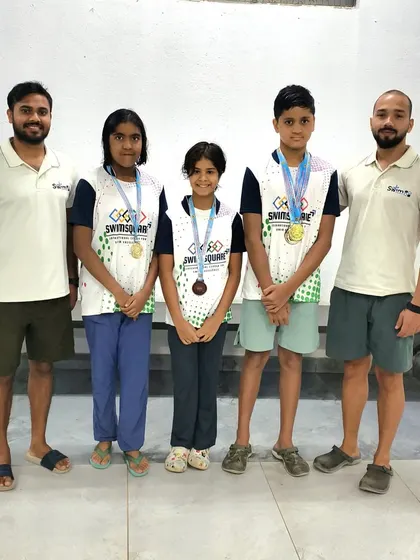 Our team's first appearance at the Karnataka State Mock Meet was a huge success. Here are our young swimmers with their coaches, celebrating a total of five medals.