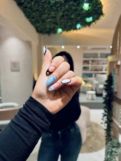 A close-up of a bold, abstract nail art design, showing how we can match your nails to your personal style.