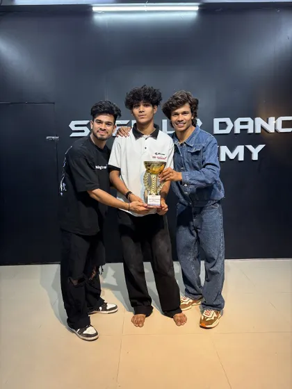 This student's hard work in our personal training batch paid off. Holding this trophy is a testament to his dedication to the craft of dance.