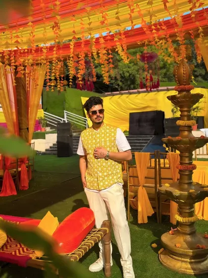 A full-length shot showing the beautiful Haldi decor. I always ensure my setup blends seamlessly with the event's aesthetic while delivering powerful sound.