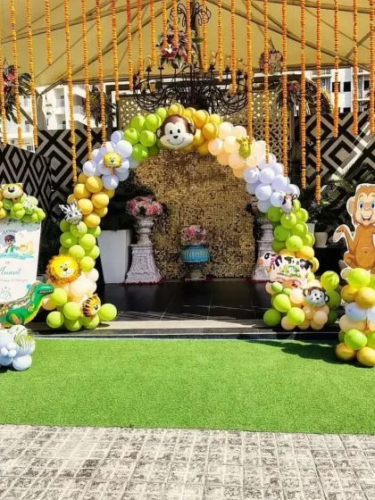 I make sure the celebration starts right at the door. This grand entrance arch for a jungle-themed mundan ceremony sets an exciting tone for guests as soon as they arrive.