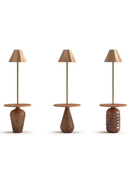 A product showcase of three lamp and table combinations from the 'Bernard and friends' collection. Each piece features a uniquely turned wooden base, celebrating the artistry of woodturning and natural forms.