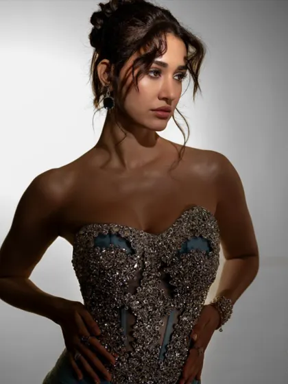 A dramatic shot of Disha Patani, with our jewellery adding the perfect finishing touch to her glamorous look.