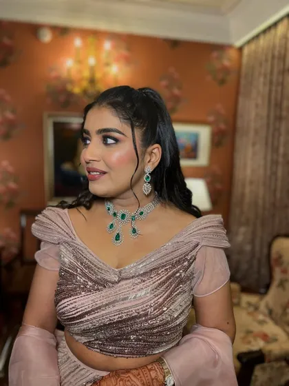 A side profile of the engagement look, showing the beautiful hairstyle and the way the makeup enhances her features.