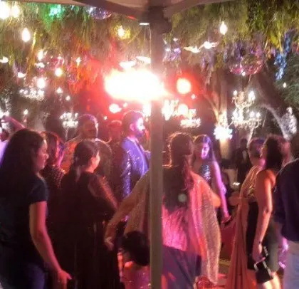 The party is on fire with a flare lighting up the dance floor.
