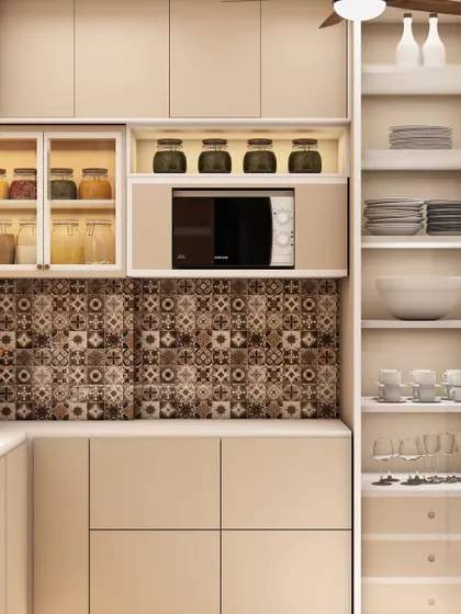 A close-up of the smart storage solutions, including open shelving for crockery and a dedicated space for the microwave.