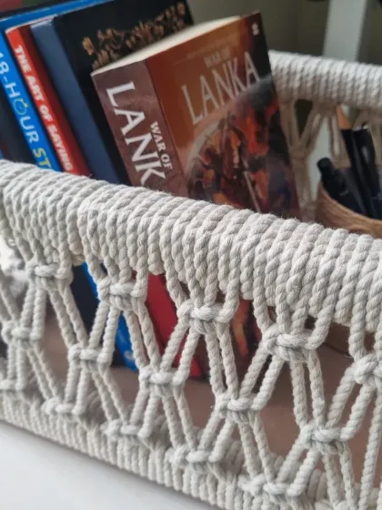 My multipurpose macrame baskets are where function meets beauty. This one, shown here holding books, is built on a sturdy wooden frame, making it perfect for organizing your essentials or creating a beautiful, personalized gift hamper.