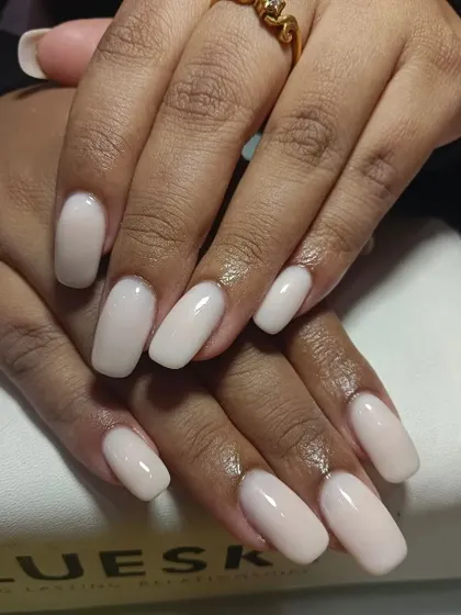 The perfection of these nude nails is unmissable. This is a simple, clean set of long, square-shaped extensions in a beautiful opaque nude shade.