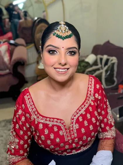 The lovely Drishti, all smiles and ready for her wedding. Her airbrush bridal makeup ensures a flawless, long-lasting finish.