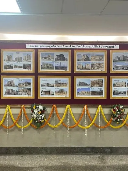 A display board at the inauguration of AIIMS Guwahati showcases the journey of the project from conception to completion. It highlights the various stages of design and construction that brought this monumental healthcare campus to life.