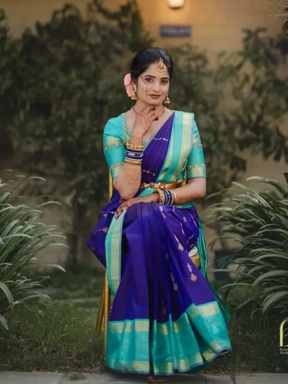 A stunning portrait of my client Ramya. The vibrant colors of her saree are balanced with elegant, soft glam makeup and a traditional hairstyle with a single pink rose.