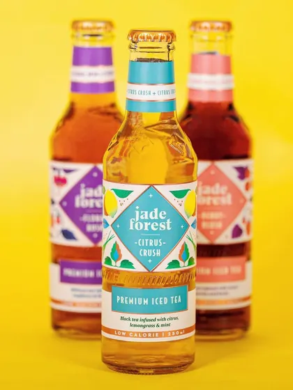 We used a bright, high-key lighting setup with a complementary color background for Jade Forest's iced tea. This approach makes the beverage look refreshing and vibrant, perfect for a summer product launch.