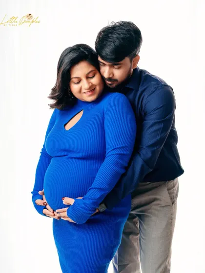 A tender embrace from behind is a classic pose that feels both protective and intimate. This couple looks so happy and in love.