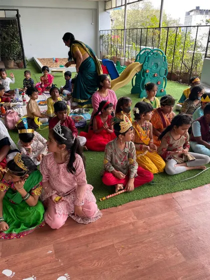 A wide view of our Janmashtami celebration, with children in colorful traditional dress. These community gatherings are filled with stories, songs, and shared food, creating a vibrant and festive atmosphere.