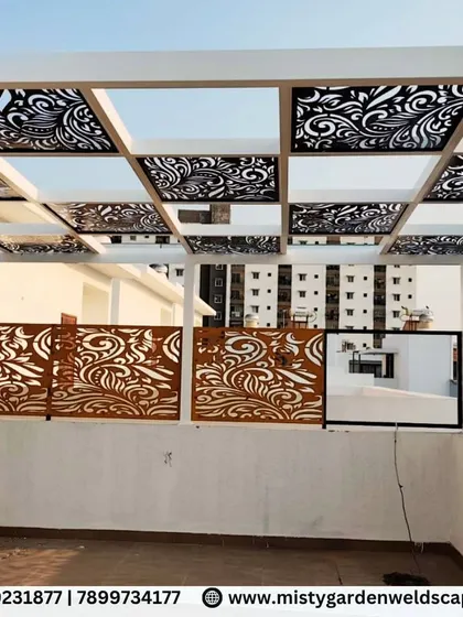 Our designs combine strength with intricate beauty. This luxury pergola at Natura Atavi features a durable puff sheet roof for all-weather protection, complemented by custom CNC designer panels that provide privacy and a bold, artistic statement.