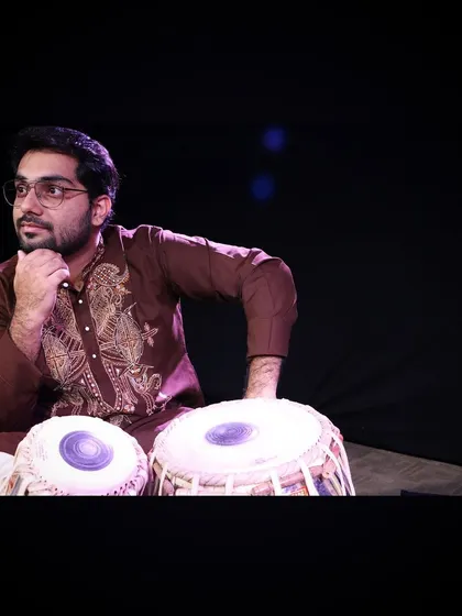 A pensive moment during a photoshoot. For me, playing the tabla is a meditative experience, a way to connect with a deeper part of myself and the music.