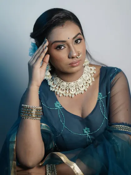 A close-up portrait that captures the modern aesthetic of the makeup.