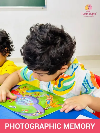 A young boy is completely focused on a colorful puzzle. This kind of deep concentration is a skill that our activities help to build, laying the groundwork for future academic success.