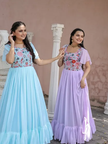 I also create lighter, more whimsical gowns. These pastel blue and lavender dresses feature floral embroidered bodices and flowing georgette skirts, ideal for a daytime event or pre-wedding shoot.