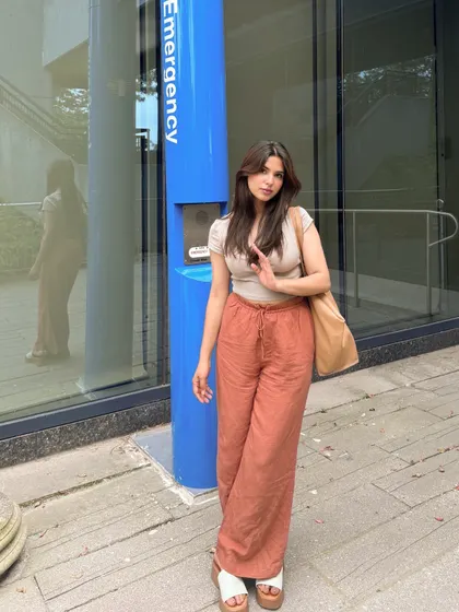 Posing in my comfy and colorful linen pants outfit.