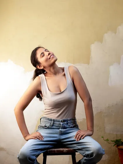 An expressive, sun-kissed shot that feels authentic and unposed, conveying a sense of peace and contentment.