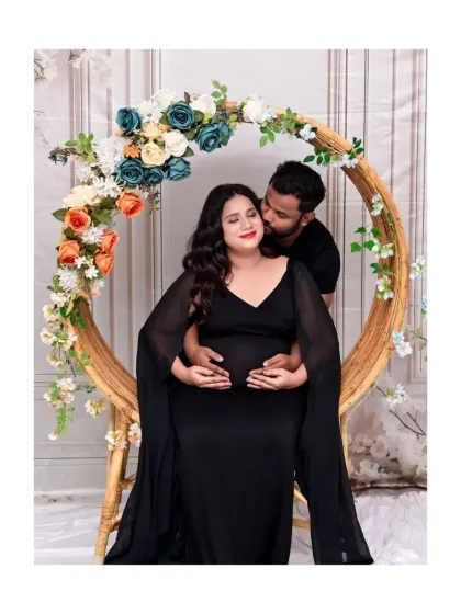A romantic couple's portrait using our circular floral prop. The black outfits create a dramatic and elegant look, while the pose is full of intimacy and affection.