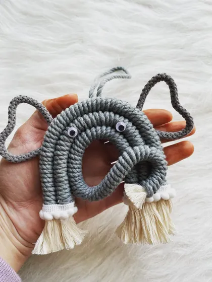 A cute and chunky macrame elephant with big ears and expressive eyes. This little guy is perfect for any elephant lover.