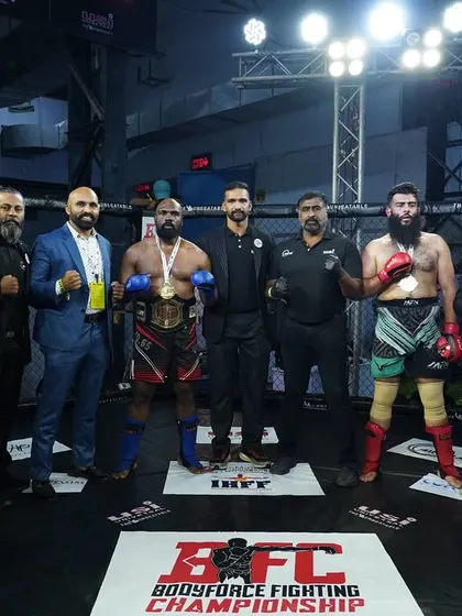 The official lineup after the championship fight. Standing with fellow competitors and officials, this image captures the sportsmanship and respect at the heart of martial arts.