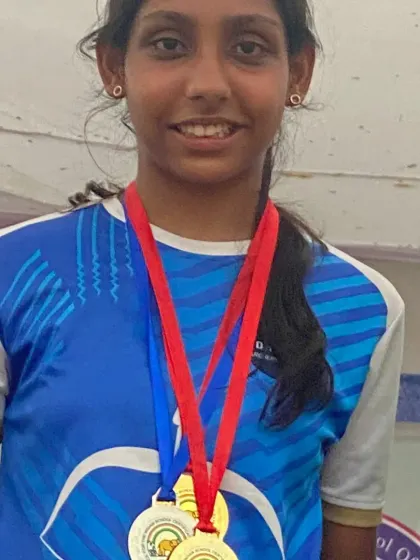 A close-up of a champion with her well-earned medals. This level of success is what our competitive archery program is designed to achieve.
