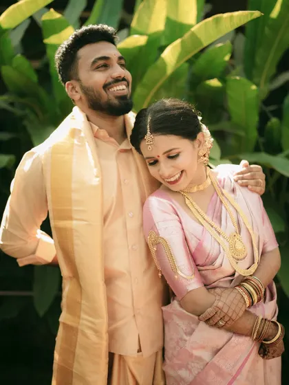 A joyful and candid portrait of the couple, their laughter lighting up the frame.