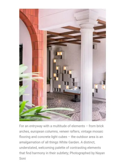 Described as an "amalgamation of all things White Garden," this entryway featured in Elle Decor showcases a multitude of contrasting elements that find harmony in their subtlety.