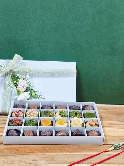 My large 24-piece assortment is perfect for sharing with the whole family on Raksha Bandhan. This box offers a wide variety of my artisanal mithai and chocolates, ensuring there's a favorite for everyone.