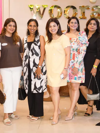 A group of mothers gathered for a photo, all smiles during the celebration. We love seeing parents enjoy the party as much as their children.