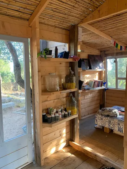 The interior of our retreat accommodation in Sardinia, filled with natural light. The environment is designed to be simple, clean, and supportive of your sadhana.