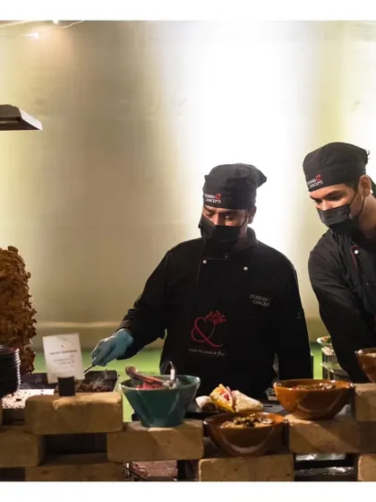 Our live shawarma station, where chefs carve spiced meat from a vertical rotisserie to create delicious wraps.