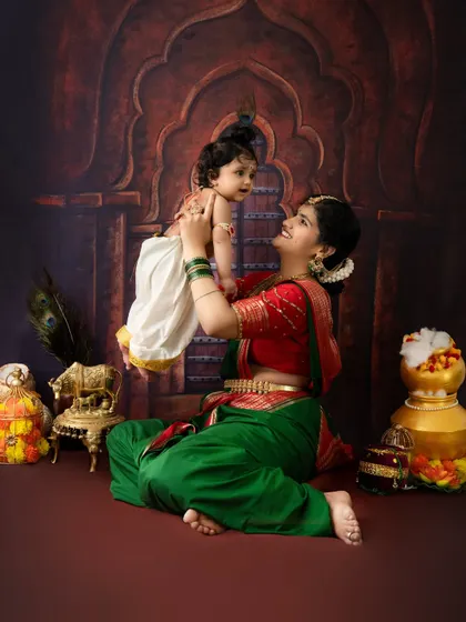 A playful moment between mother and son during their Janmashtami shoot. I love capturing the natural interactions that show their bond.