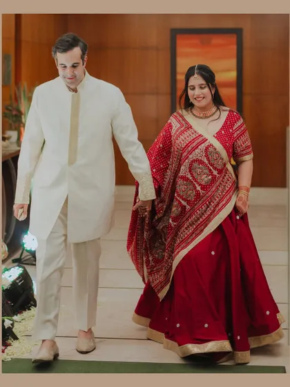 The couple walks hand-in-hand, sharing a happy moment together. This candid shot captures the ease and comfort of their 12-year love story.