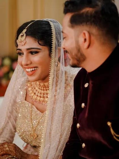 The shared laughter between a bride and groom is one of the most beautiful things to capture. This candid shot is full of genuine joy.