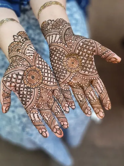 Another angle of this lovely bridal mehndi, showcasing the detailed work on the fingers and wrist.