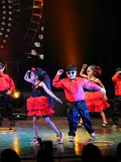 The kids' group showing off their cool sunglasses and coordinated moves in this fun, high-energy Bollywood number.