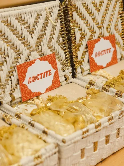 A close-up of the festive hampers we created for Loctite, featuring beautiful white and gold woven boxes. We pride ourselves on creating unique and high-quality gifts for our corporate partners.