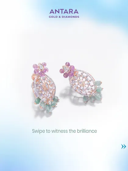 A fusion of strength and elegance. These exclusive earrings feature intricate diamond work with pink and green gemstone drops.