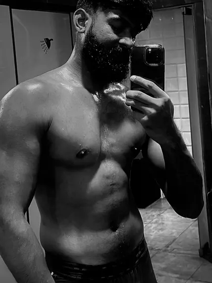"You can look but don’t touch." A sweaty, post-workout selfie in black and white.