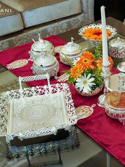 An exquisite Diwali tablescape featuring my silverware collection. The intricate trays, serving bowls, and candle holders are crafted to make your home shine as brightly as the festival of lights.