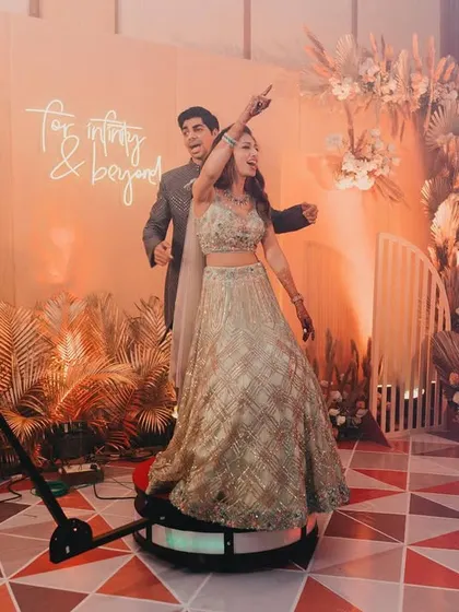 The 360-degree photo booth in action. We designed the backdrop to be stunning from every angle, ensuring the couple's memories were captured in style.