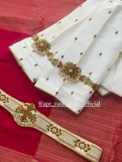 Another view of the off-white blouse and belt set.