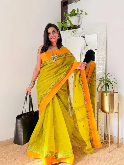 A sunny yellow and orange Tant saree that is perfect for a summer day. The colors are so cheerful, and the pure cotton fabric is a delight to wear.