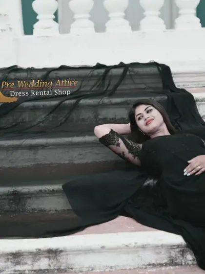 A reclining pose on a staircase, showing how the black trail gown can be used to create elegant, high-fashion inspired portraits.