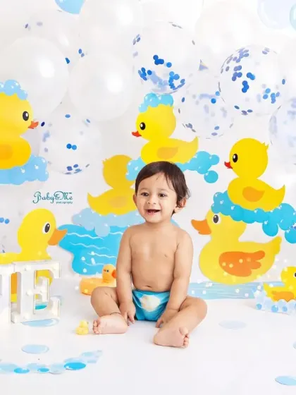 This little one's happy expression says it all. The duck theme is a classic for a reason, it's just pure, simple fun for a baby boy's first birthday.