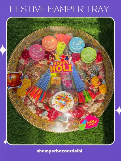 A top-down view of our festive Holi hamper tray. The arrangement is designed to be visually stunning, with a vibrant mix of colors and textures that scream celebration.